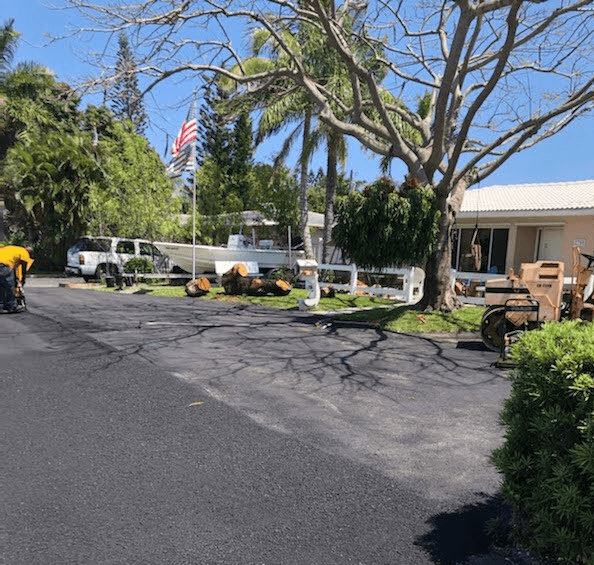 Asphalt driveway being repaired and resurfaced in Coral Springs, FL