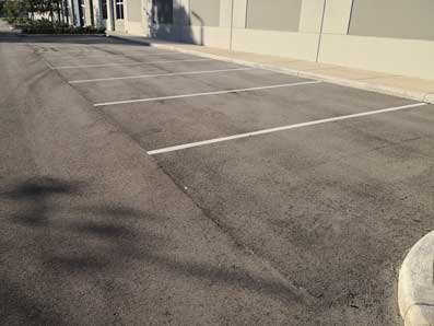 Asphalt parking lot with painted lines, in Fort Lauderdale, FL